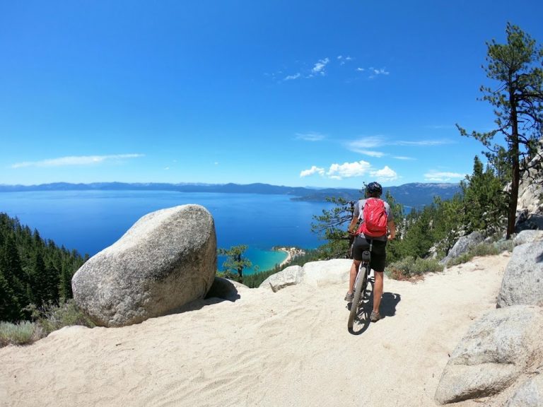 Person overlooking Lake Tahoe from high upon the Flume Trail.