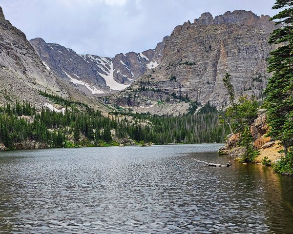lake surrounded by mountains.