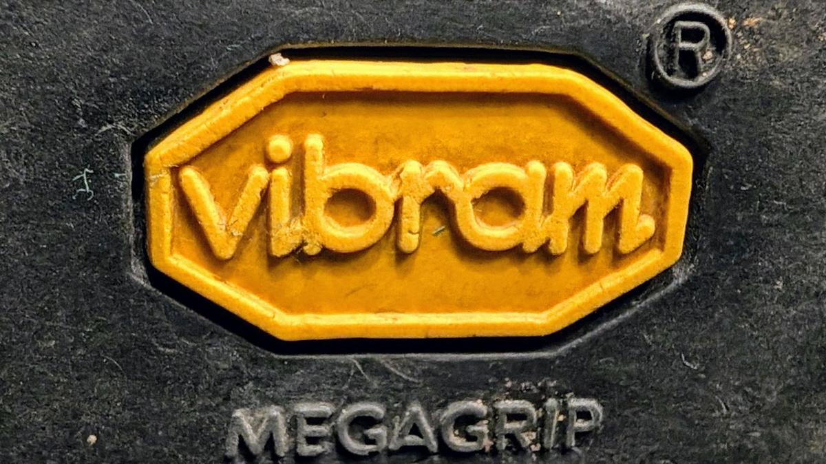 Macro photo of the yellow Vibram octagon on a boot sole